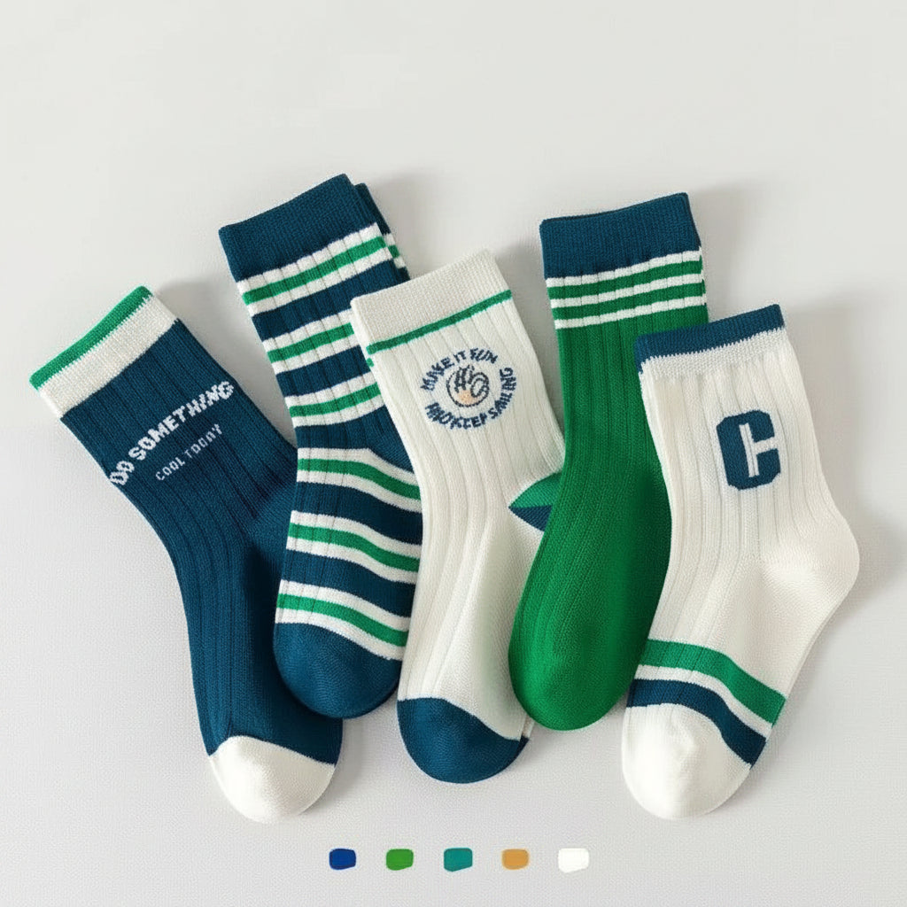 Five pairs of ankle socks arranged on a light gray background under the text 'Autumn New Arrivals.' The socks are in blue, green, and white colorways with striped cuffs and toes, ribbed shafts, and decorative logos or text.